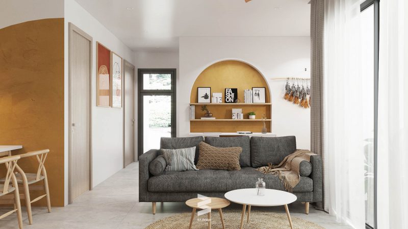 Không gian phòng khách ấn tượng và thoải mái với bộ sofa nâu xám và màu vàng nâu trang trí trên tường