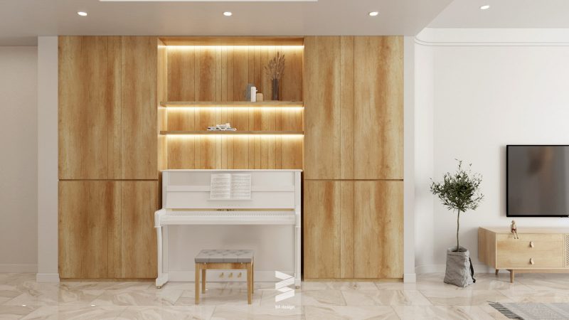 Nhà phố Long Biên: Tủ đựng đồ và bộ đàn piano được thiết kế sát tường và đối diện cầu thang như một điểm kết nối giữa phòng khách và nhà bếp 