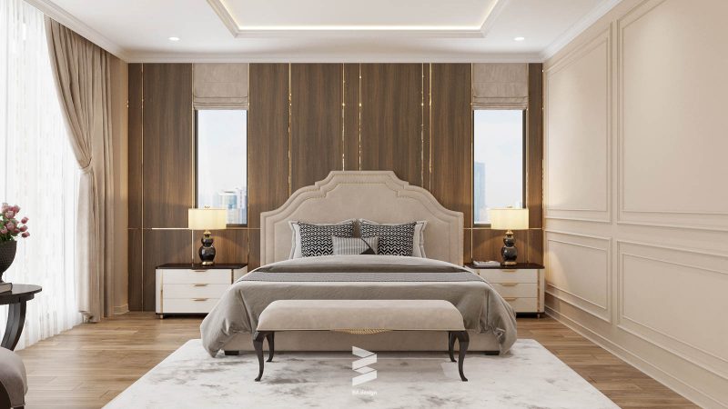 Phòng ngủ master đậm chất thiết kế tân cổ điển với các đường cong trên thành giường đặc trưng cổ điển và hệ thống tủ hiện đại đằng sau 